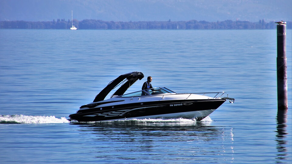 Man using Speedboat on blue sea